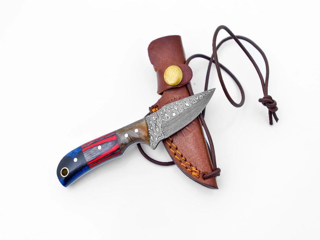 Texas Neck Knife with Damascus steel drop point blade and multicolored handle, paired with a brown leather sheath and neck cord.