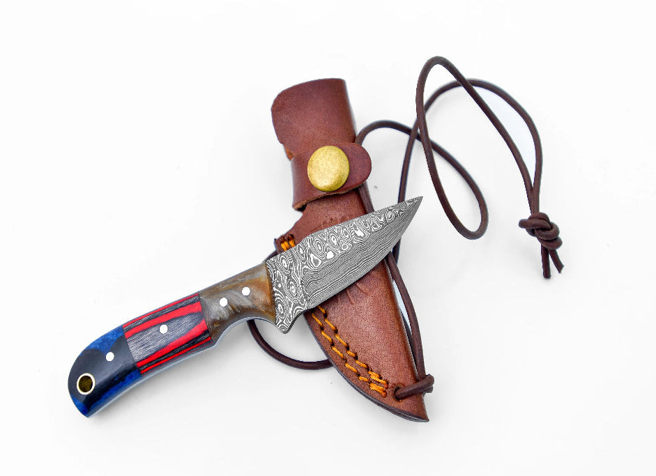 Texas Neck Knife with Damascus steel drop point blade and multicolored handle, paired with a brown leather sheath and neck cord.
