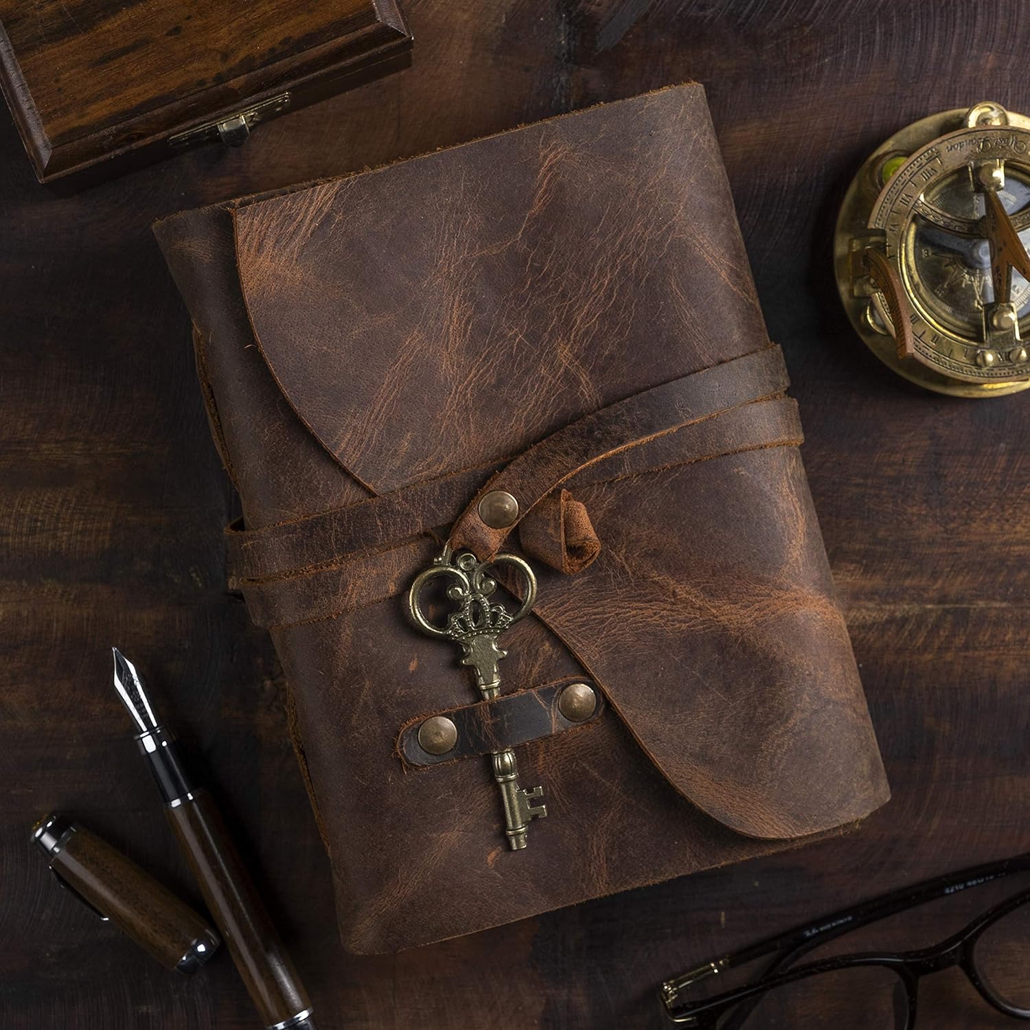 Leather Journal with antique key clasp and wrap closure, 8x6 deckled edge pages, ideal for writing or sketching.