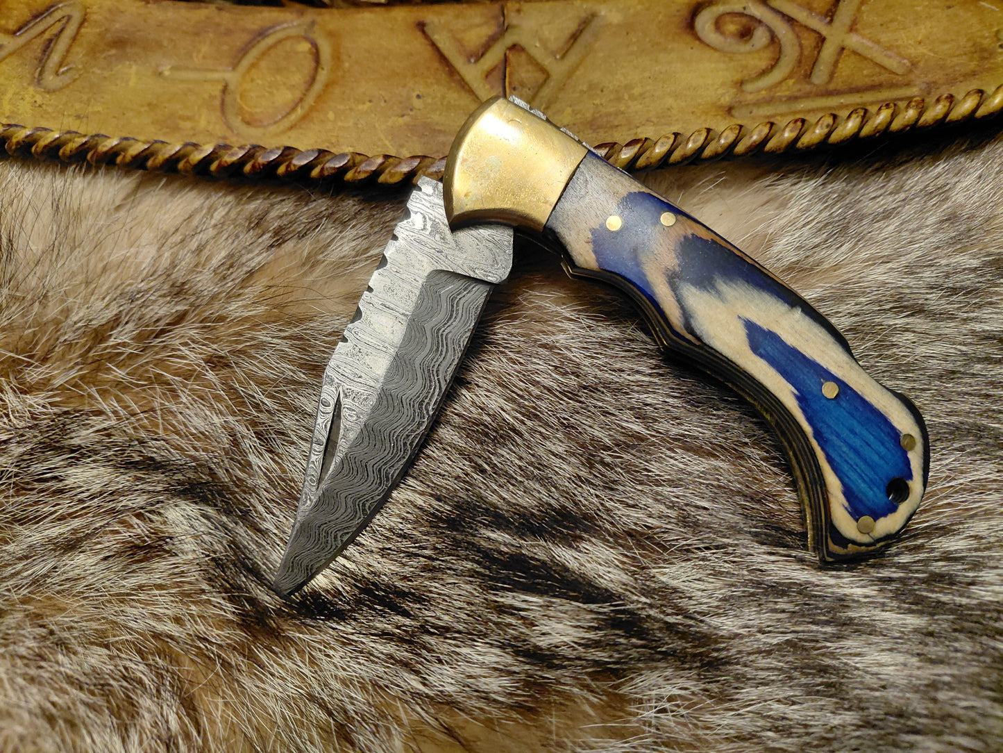 Blue wave folding knife