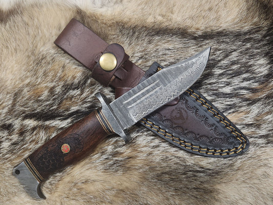 Eagles Valor hunting collectible knife with Damascus steel blade, engraved wooden handle, and tooled leather sheath.